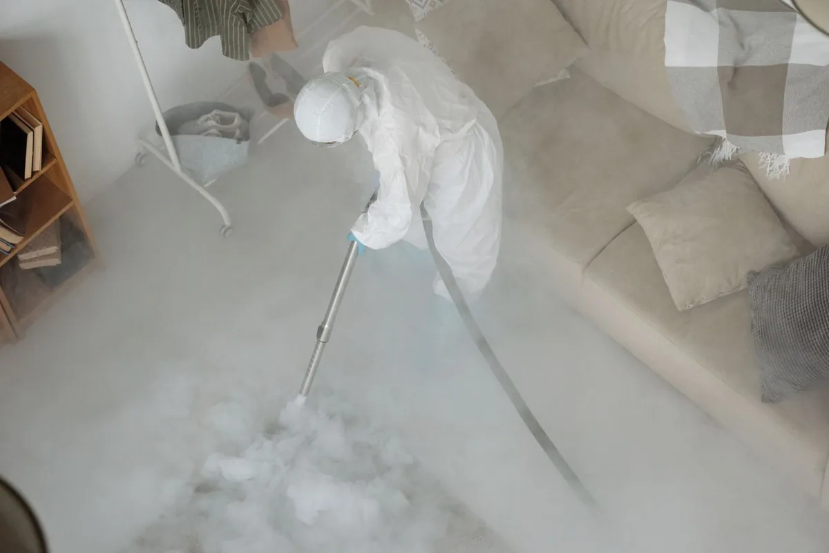 Biohazard cleanup technician in protective equipment, Avoca, PA